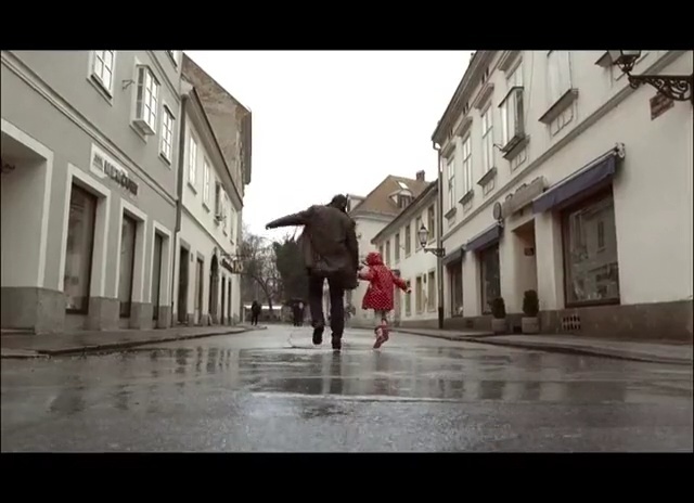 Video Reference: Town, Photograph, Street, Neighbourhood, Pedestrian, Snapshot, Road, Human settlement, Urban area, Mode of transport, Person