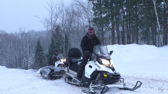 Video Reference: snowmobile, motor vehicle, snow, vehicle, winter, geological phenomenon, winter sport, freezing, ice, adventure, Person
