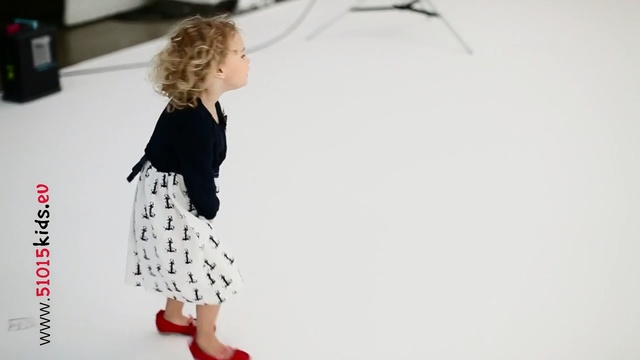 Video Reference: White, Clothing, Dress, Child, Pattern, Shoulder, Standing, Fashion, Footwear, Outerwear