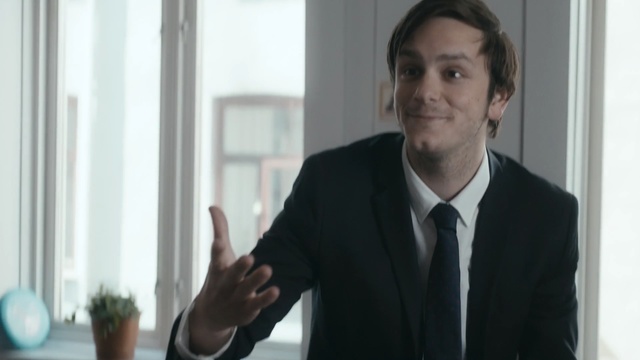 Video Reference: Suit, White-collar worker, Formal wear, Standing, Businessperson, Gesture, Business, Gentleman, Public speaking, Tuxedo, Person