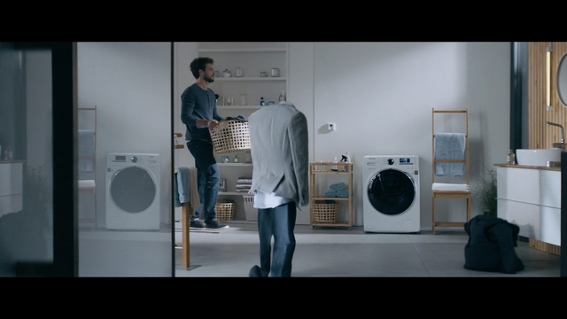 Video Reference: Major appliance, Photograph, Shoulder, Laundry room, Standing, Audio equipment, Washing machine, Clothes dryer, Snapshot, Loudspeaker, Person