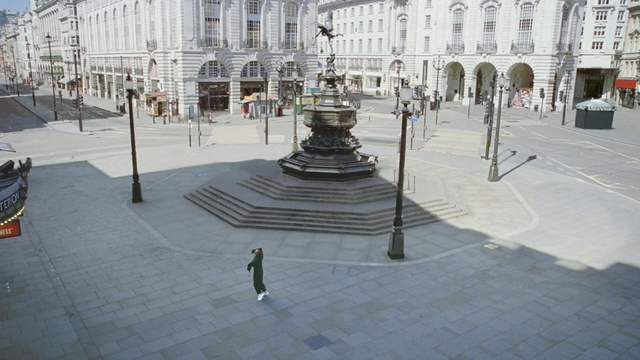 Video Reference: town square, public space, town, plaza, road surface, walkway, city, pedestrian, building, facade, Person