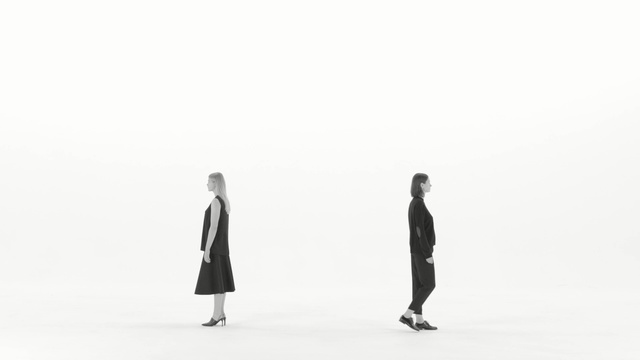Video Reference: standing, black and white, gentleman, outerwear, shoe, product, monochrome, sleeve, Person