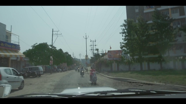 Video Reference: Mode of transport, Lane, Road, Windshield, Atmospheric phenomenon, Windscreen wiper, Town, Asphalt, Neighbourhood, Transport