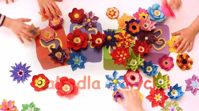 Video Reference: Finger, Font, Artificial flower, Hand, Toy, Flower, Petal, Plant, Fashion accessory, Person