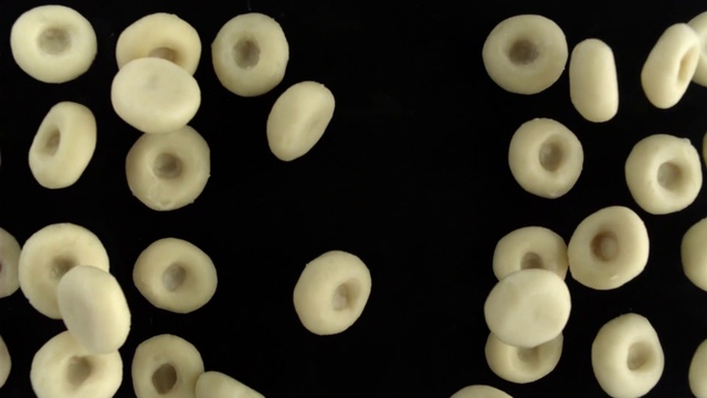 Video Reference: Circle, Plastic, Chocolate, Decorated, Indoor, Made, Cake, Light, Food, Lit, Close, Square, Black, Sitting, Looking, Blue, Covered, Dark, Topped, Birthday, Ready, Large, Face, Oven, Cutting, Necklace, White, Plate, Candle, Several