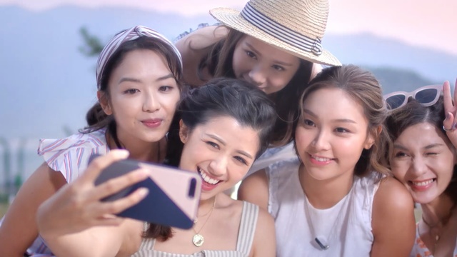 Video Reference: People, Fun, Friendship, Skin, Youth, Smile, Selfie, Happy, Photography, Vacation, Person, Outdoor, Girl, Child, Man, Posing, Young, Sitting, Little, Photo, Holding, Standing, Group, Hat, Front, Cake, Table, Bench, White, Wearing, Woman, Riding, Sky, Fashion accessory, Human face, Clothing