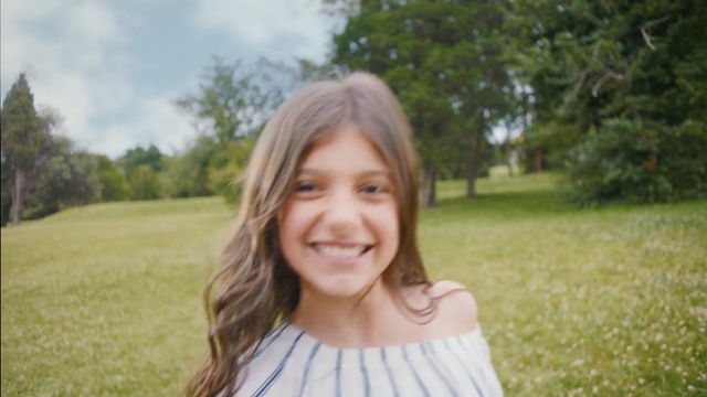 Video Reference: hair, photograph, facial expression, smile, beauty, human hair color, grass, girl, emotion, blond, Person