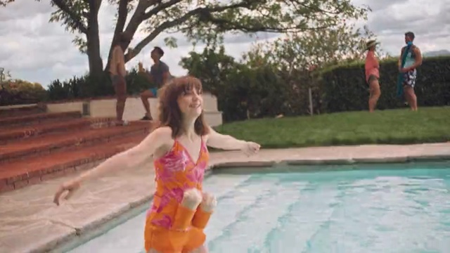 Video Reference: Swimming pool, Leisure, Fun, Vacation, Summer, Snapshot, Pink, Water, Swimwear, Tree, Outdoor, Person, Young, Girl, Grass, Holding, Woman, Little, Park, Boy, Standing, Walking, Board, Riding, Man, Frisbee, Orange, Large, Playing, Yellow, Clothing, Swimming