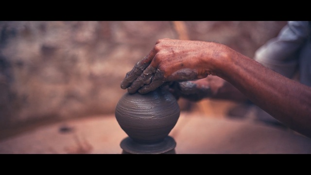 Video Reference: Pottery, Hand, Sculpture, Auto part, Art, Automotive wheel system, Clay, Potter wheel, Finger, Wheel, Person