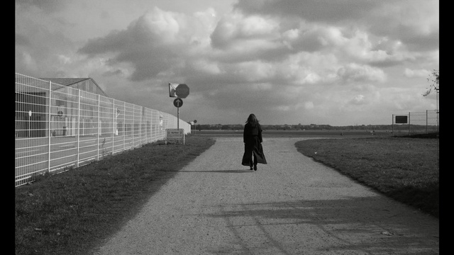 Video Reference: cloud, sky, white, black, photograph, black and white, atmosphere, monochrome photography, infrastructure, road, Person