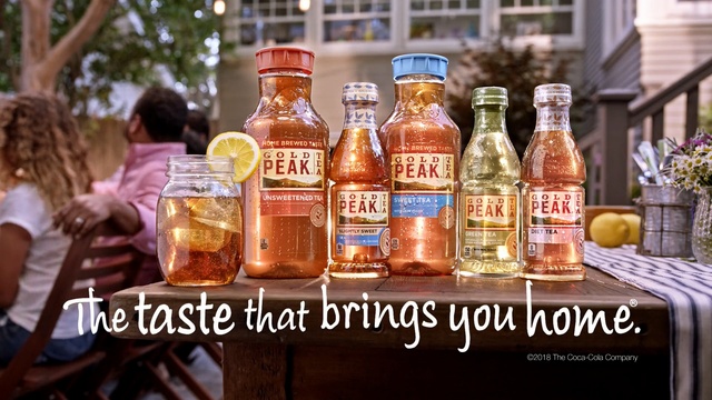 Video Reference: distilled beverage, liqueur, drink, alcoholic beverage, alcohol, bottle, beer, condiment, Person