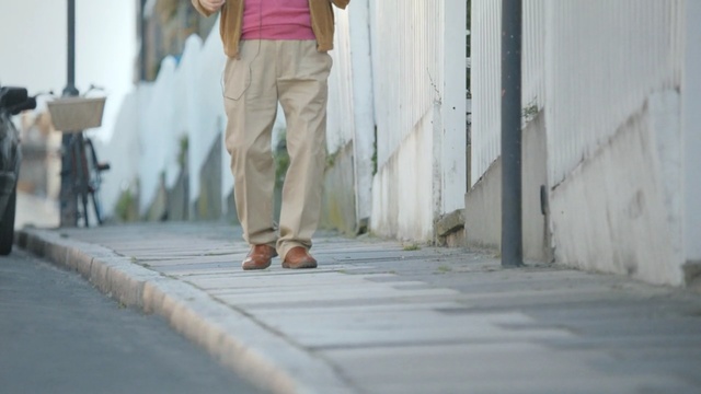 Video Reference: person, sidewalk, people, leg, man