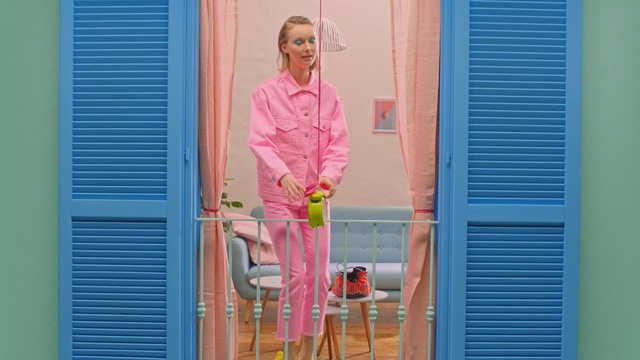 Video Reference: blue, pink, door, window, outerwear, window covering, window treatment, curtain, girl, house, Person
