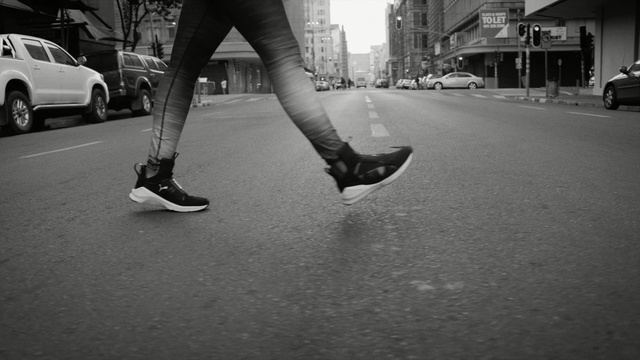 Video Reference: footwear, white, black, photograph, black and white, shoe, infrastructure, monochrome photography, road, leg, Person