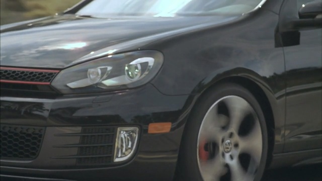 Video Reference: car, motor vehicle, vehicle, rim, wheel, alloy wheel, bumper, automotive design, volkswagen, hatchback