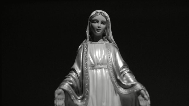 Video Reference: black and white, statue, monochrome photography, monochrome, darkness, performance, classical sculpture, monument, figurine, religion, Person