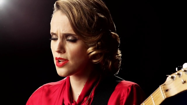 Video Reference: Hair, Lip, Hairstyle, Beauty, Musical instrument, Chin, Performance, String instrument, Singer, Music artist, Person
