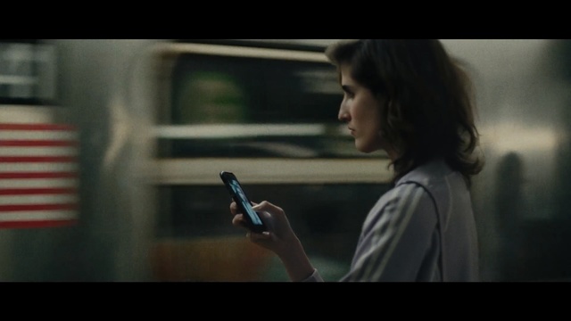 Video Reference: Beauty, Snapshot, Photography, Human, Black hair, Long hair, Screenshot, Brown hair, Smile, Fictional character, Person, Indoor, Woman, Looking, Holding, Front, Standing, Man, Cellphone, Phone, Young, Sitting, Screen, Girl, Using, Wearing, Bus, Television, Room, Train, Video, Human face, Hand, Gun