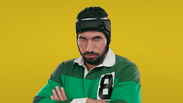Video Reference: yellow, green, headgear, personal protective equipment, team sport, outerwear, protective gear in sports, helmet, product, cap, Person