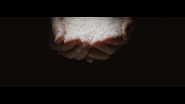 Video Reference: Hand, Finger, Nose, Skin, Darkness, Close-up, Head, Light, Arm, Mouth, Person, Holding, Dark, Man, Sitting, Television, Screen, Food, Lit, Black, Remote, Dog, Large, Room, Woman, White, Laying