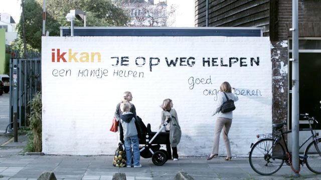 Video Reference: land vehicle, advertising, vehicle, bicycle, billboard, recreation, street, product, signage, pedestrian, Person