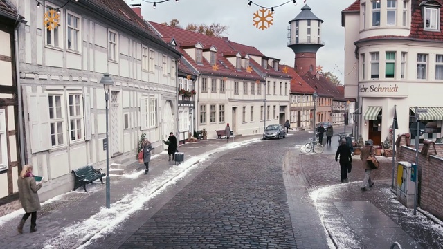 Video Reference: Town, Street, Human settlement, Building, City, Neighbourhood, Cobblestone, Road, Pedestrian, Infrastructure