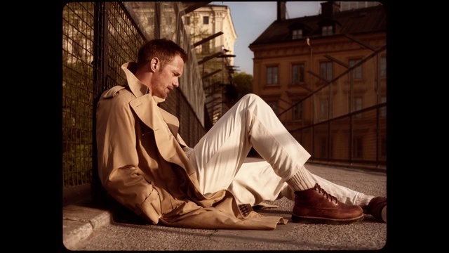 Video Reference: Sitting, Photography, Stock photography, Gentleman, Flash photography, Person, Man, Table, Front, Wearing, Board, Phone, Young, Using, Standing, White, Laptop, Holding, Computer, Street, Clothing