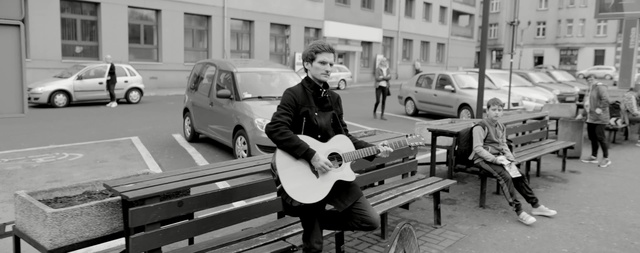 Video Reference: Music, Street performance, Snapshot, Vehicle, Musician, Car, Street, Photography, Black-and-white, Sitting