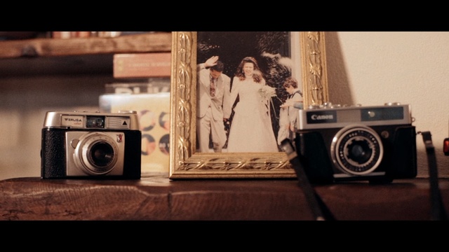 Video Reference: Point-and-shoot camera, Cameras & optics, Camera, Photograph, Electronics, Digital camera, Camera accessory, Photography, Room, Mirrorless interchangeable-lens camera