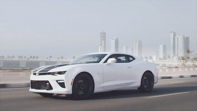 Video Reference: Land vehicle, Vehicle, Car, Chevrolet camaro, White, Automotive design, Performance car, Motor vehicle, Muscle car, Coupé, Person
