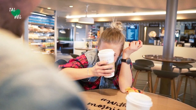 Video Reference: Restaurant, Fun, Fast food restaurant, Food court, Fast food, Customer, Building, Person, Indoor, Table, Ceiling, Food, Sitting, Coffee, Cup, Front, Drinking, Woman, Eating, Kitchen, Plate, Young, Cake, Man, Donut, Pizza, Holding, Standing, Computer, People, White, Clothing, Tableware, Text, Human face, Meal