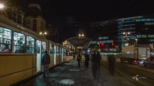 Video Reference: metropolitan area, night, transport, mode of transport, metropolis, urban area, town, public transport, city, downtown, Person