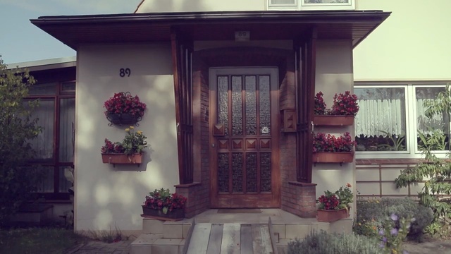 Video Reference: home, property, house, window, door, facade, porch, outdoor structure, estate, cottage