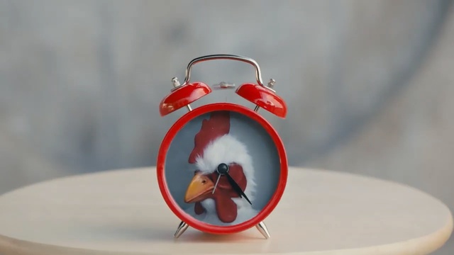 Video Reference: Red, Alarm clock, Ornament, Animation, Christmas ornament, Fictional character, Interior design
