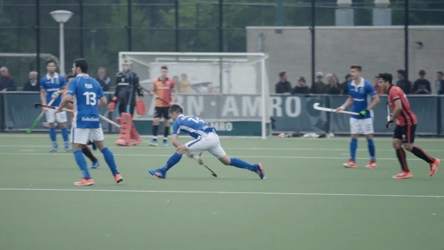 Video Reference: Player, Sports, Team sport, Ball game, Tournament, Sports equipment, Sport venue, Field hockey, Football player, Football, Person