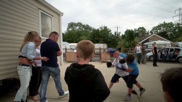 Video Reference: community, recreation, event, vehicle, sports, fun, race, crowd, tree, walking, Person