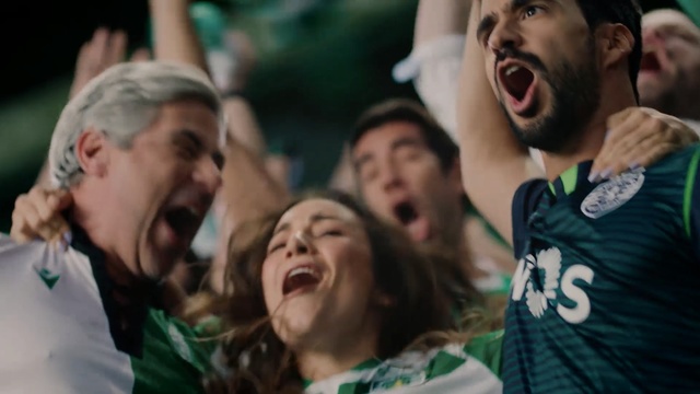 Video Reference: People, Facial expression, Product, Shout, Fun, Crowd, Laugh, Cheering, Fan, Happy, Person, Man, Teeth, Holding, Young, Mouth, Woman, Group, Hair, Standing, Green, Face, Brushing, Game, Shirt, Girl, Wearing, Playing, Player, Ball, Head, Food, White, Frisbee, Human face, Smile, Clothing, Boy