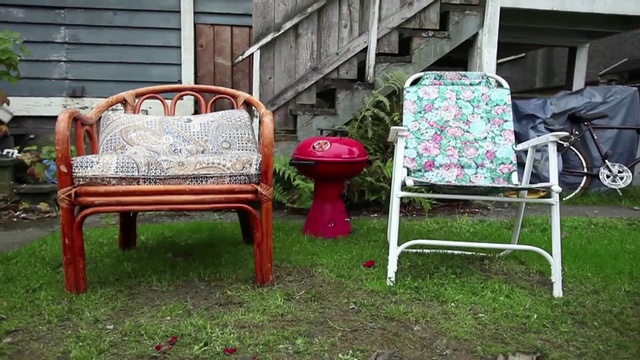 Video Reference: Furniture, Chair, Outdoor furniture, Yard, Grass, Lawn, Backyard, Wicker, Garden, Patio, Person