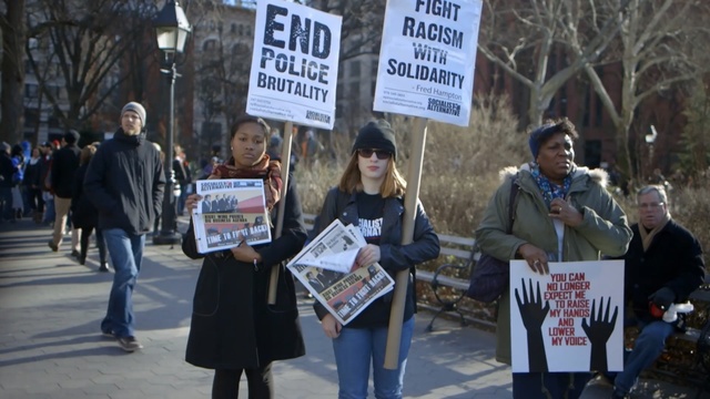 Video Reference: protest, event, demonstration, street, crowd, public event, pedestrian, city, Person