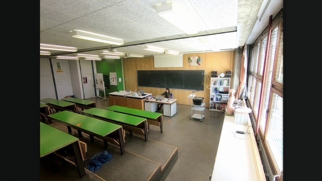 Video Reference: Room, Building, Property, Interior design, Table, Furniture, Architecture, Ceiling, Office, Floor