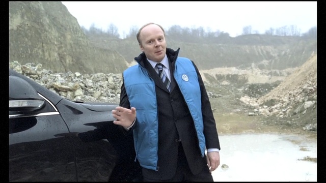 Video Reference: car, automotive design, vehicle, luxury vehicle, sedan, suit, tree, Person