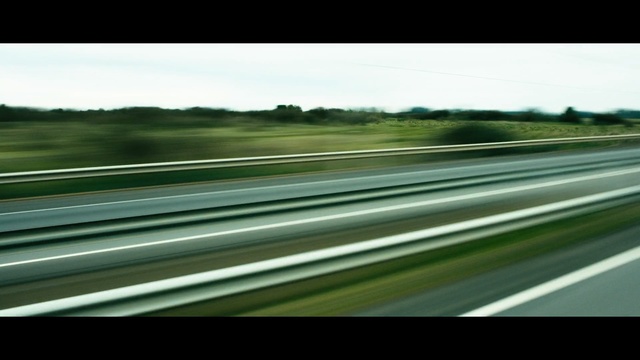 Video Reference: road, highway, infrastructure, mode of transport, lane, sky, line, guard rail, car, controlled access highway