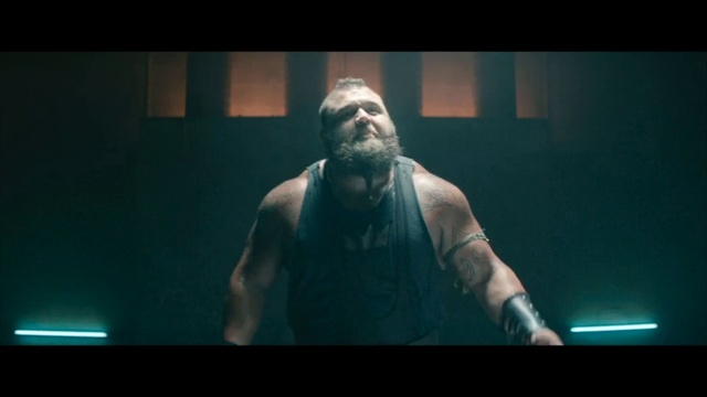 Video Reference: Arm, Muscle, Performance, Facial hair, Screenshot, Barechested, Beard, Fictional character, Darkness, Music, Person