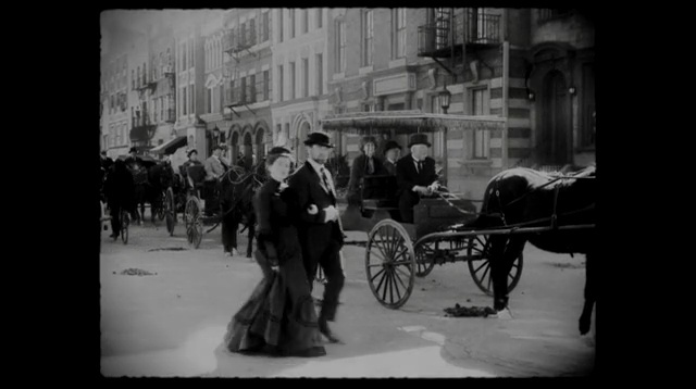 Video Reference: black, black and white, photograph, monochrome photography, carriage, mode of transport, photography, coachman, snapshot, street, Person