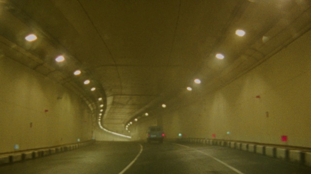 Video Reference: Road, Tunnel, Highway, Thoroughfare, Freeway, Lane, Infrastructure, Metropolitan area, Light, Mode of transport