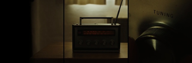 Video Reference: electronic device, darkness, technology, electronics, sound, audio equipment, Person