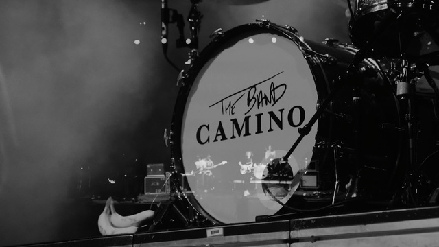 Video Reference: Drum, Bass drum, Drumhead, Drums, Black, Musical instrument, Black-and-white, Gong bass drum, Musician, Monochrome photography, Person