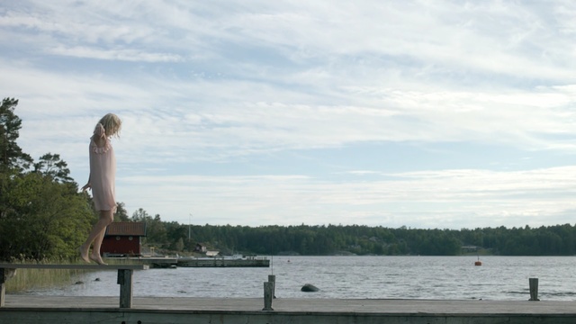 Video Reference: sky, lake, reservoir, tree, water, cloud, loch, river, sea, tower, Person