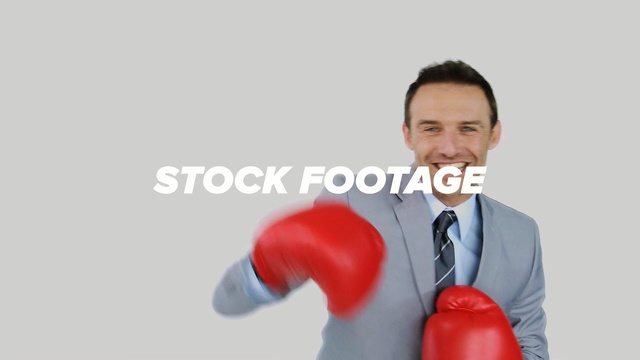 Video Reference: boxing equipment, boxing glove, megaphone, product, microphone, communication, Person